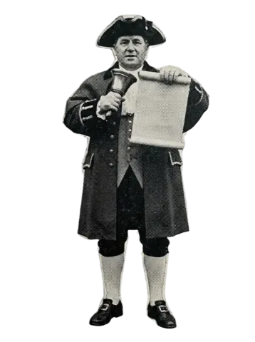 A town crier in uniform reading a notice