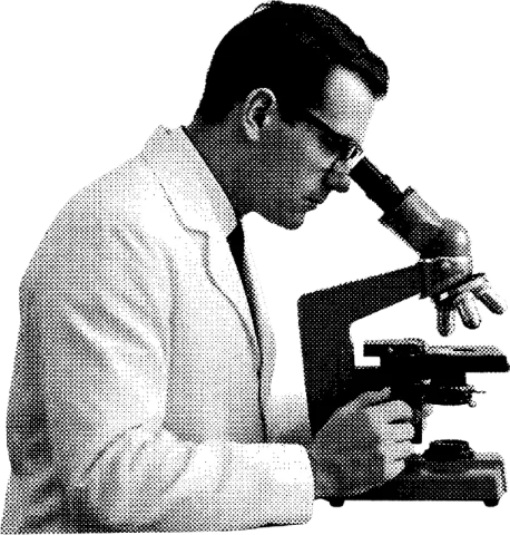 A scientist at a microscope
