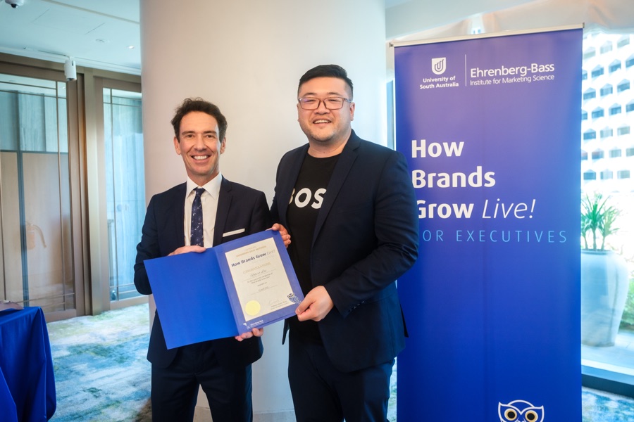 Robert Lai receiving the How Brands Grow Live! for Executives certificate from Professor Byron Sharp